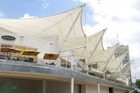 Tensile roofing structure